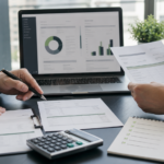 Finance professionals reviewing purchase orders, supplier invoices and an accounts payable approval checklist